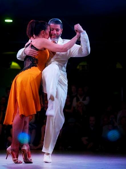Graciela and Osvaldo with Osvaldo in mid-kick.